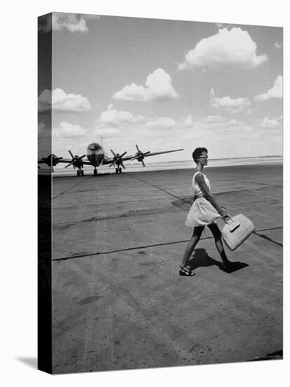 American Airline Hostess Crossing Field on Way to Jobs as a Model and Sales Clerk at Neiman Marcus-Lisa Larsen-Stretched Canvas