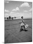 American Airline Hostess Crossing Field on Way to Jobs as a Model and Sales Clerk at Neiman Marcus-Lisa Larsen-Mounted Photographic Print