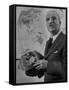 American Engineer and Architect Buckminster Fuller Holding a Globe-Andreas Feininger-Framed Stretched Canvas