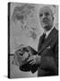 American Engineer and Architect Buckminster Fuller Holding a Globe-Andreas Feininger-Stretched Canvas