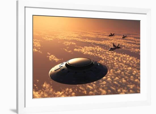 American F-22 Stealth Raptor Aircraft Chasing a Much Larger Ufo-null-Framed Art Print