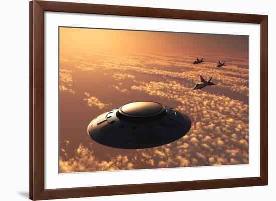 American F-22 Stealth Raptor Aircraft Chasing a Much Larger Ufo-null-Framed Art Print