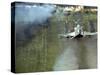 American F4C Phantom Jet Firing Rockets into Viet Cong Stronghold village During the Vietnam War-Larry Burrows-Stretched Canvas