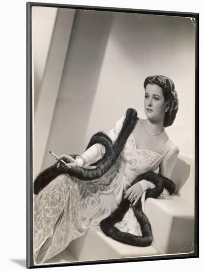 American Film Star Joan Bennett Models a Dress She Wears in Her Latest Picture "Girl Trouble"-null-Mounted Art Print