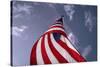 American Flag Against Blue-null-Stretched Canvas
