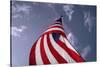 American Flag Against Blue-null-Stretched Canvas