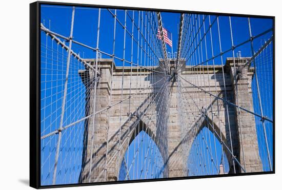 American flag flying over Brooklyn Bridge, New York City, New York-null-Framed Stretched Canvas