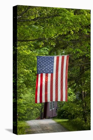 American Flag Hanging Above Gravel Road-Paul Souders-Stretched Canvas