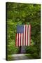 American Flag Hanging Above Gravel Road-Paul Souders-Stretched Canvas