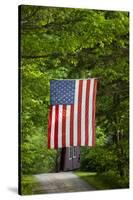 American Flag Hanging Above Gravel Road-Paul Souders-Stretched Canvas