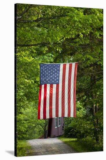 American Flag Hanging Above Gravel Road-Paul Souders-Stretched Canvas