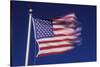 American Flag is Blurred with the Motion of the Wind against the Blue Sky-Richard T. Nowitz-Stretched Canvas