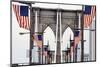 American Flags Lining Brooklyn Bridge-null-Mounted Photographic Print