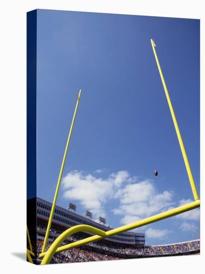 American Fooball Flying Through the Goalposts-null-Stretched Canvas