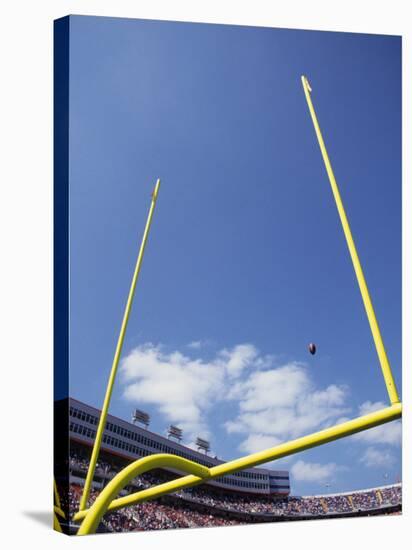 American Fooball Flying Through the Goalposts-null-Stretched Canvas