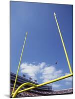 American Fooball Flying Through the Goalposts-null-Mounted Photographic Print