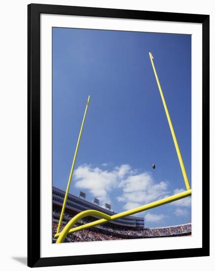 American Fooball Flying Through the Goalposts-null-Framed Photographic Print