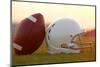 American Football and Helmet on the Field at Sunset-33ft-Mounted Photographic Print