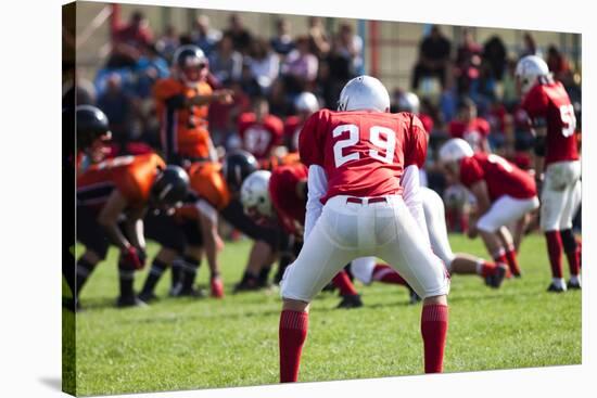 American Football Game with out of Focus Players in the Background-melis-Stretched Canvas