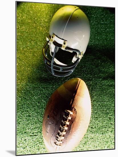 American Football Helmet and a Football-null-Mounted Photographic Print