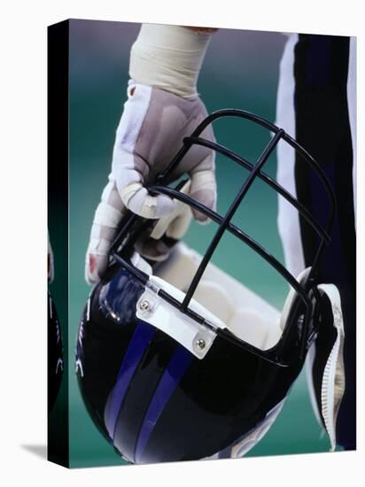 American Football Player Holding His Helmet-Chris Trotman-Stretched Canvas