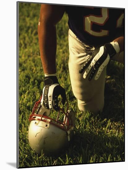 American Football Player Kneeling on the Field-null-Mounted Photographic Print