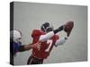 American Football Player Reaching for the Ball-null-Stretched Canvas