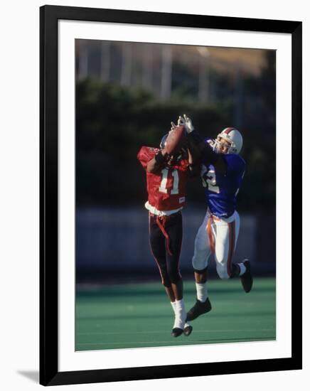 American Football Player Reaching for the Ball-null-Framed Photographic Print