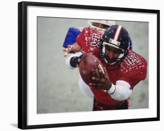 American Football Player Reaching for the Ball-null-Framed Photographic Print