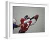 American Football Player Reaching for the Ball-null-Framed Photographic Print