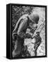 American Lieutenant Carrying Micronesian Baby He Found in cave Japanese Soldiers Holed Up There-W^ Eugene Smith-Framed Stretched Canvas