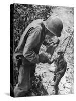 American Lieutenant Carrying Micronesian Baby He Found in cave Japanese Soldiers Holed Up There-W^ Eugene Smith-Stretched Canvas
