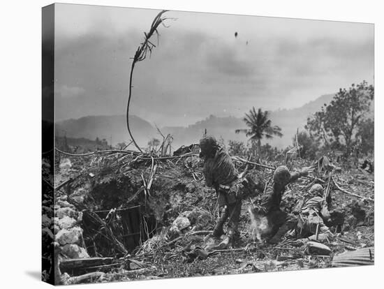 American Marine Hurls Hand Grenade Towards Japanese Position as His Partner Prepares to Do the Same-null-Stretched Canvas