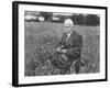 American Poet, Robert Frost Standing in Meadow During Visit to the Gloucester Area of England-Howard Sochurek-Framed Premium Photographic Print