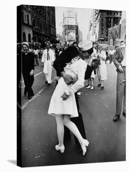 American Sailor Clutching a White-Uniformed Nurse in a Passionate Kiss in Times Square-Alfred Eisenstaedt-Stretched Canvas