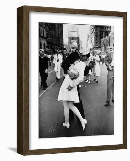 American Sailor Clutching a White-Uniformed Nurse in a Passionate Kiss in Times Square-Alfred Eisenstaedt-Framed Photographic Print