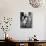 American Sailor Clutching a White-Uniformed Nurse in a Passionate Kiss in Times Square-Alfred Eisenstaedt-Photographic Print displayed on a wall