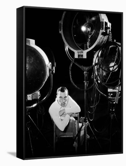 American silent screen comedian and actor Buster Keaton (1895 - 1966) surrounded by studio lighting-null-Framed Stretched Canvas