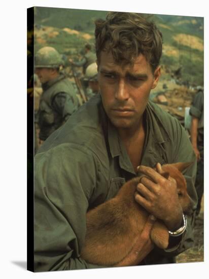 American Soldier Cradling Dog While under Siege at Khe Sanh-Larry Burrows-Stretched Canvas