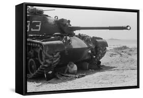 American soldier reads a newspaper in the shade under a U.S. Marine tank in Beirut, Lebanon, 1958-Thomas J. O'halloran-Framed Stretched Canvas