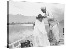 American Tourist, Young Danny Thomas Receiving Hair Cut on House Boat During Vacationing-James Burke-Stretched Canvas