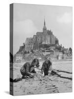 American Travelers Building a Sand Replica of France's Medieval Abbey at Mont Saint Michel-Yale Joel-Stretched Canvas