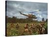 American UH1 Huey Helicopter Lifting Off as Personnel on the Ground Protect Themselves-Larry Burrows-Stretched Canvas