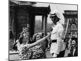 American Women Mobbing a Policeman on Traffic Duty at the Chain Bridge-null-Mounted Photographic Print