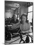 American Working Woman Sitting at Her Typewriter and Talking on the Telephone-Nina Leen-Mounted Photographic Print