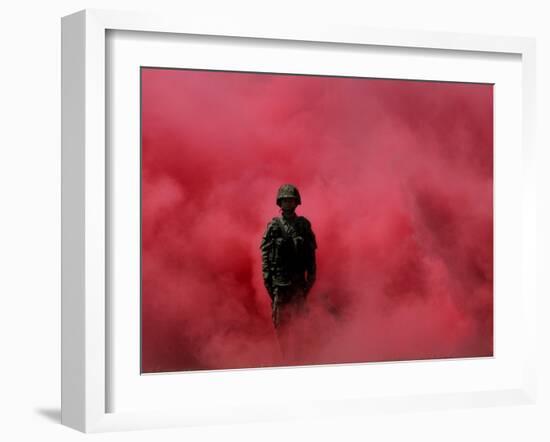 Amidst Smoke from a Flare, a Soldier Attends a Military Ceremony in Cali, Colombia-null-Framed Photographic Print