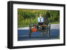 Amish driving a horse-drawn cart, Pennsylvania, USA-null-Framed Art Print