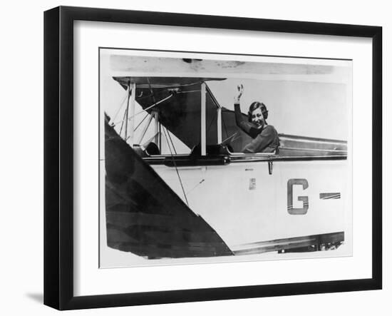 Amy Johnson (Mrs Mollison) Sits in Her Plane and Smiles and Waves to the Camera-null-Framed Art Print