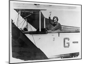 Amy Johnson (Mrs Mollison) Sits in Her Plane and Smiles and Waves to the Camera-null-Mounted Art Print
