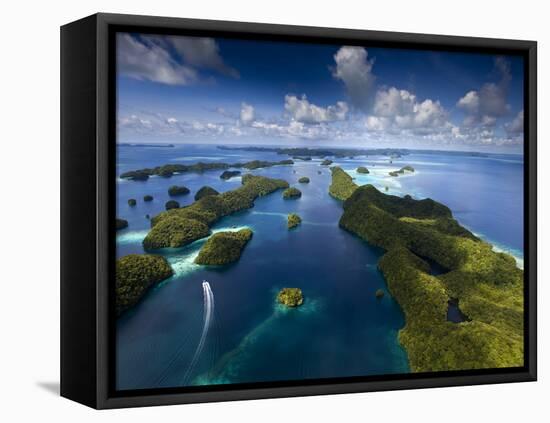 An Aerial View of a Boat as it Speeds Through the Rock Islands, Republic of Palau.-Ian Shive-Framed Stretched Canvas